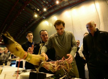 Andre Agassi and Pete Sampras carving our Jamón.